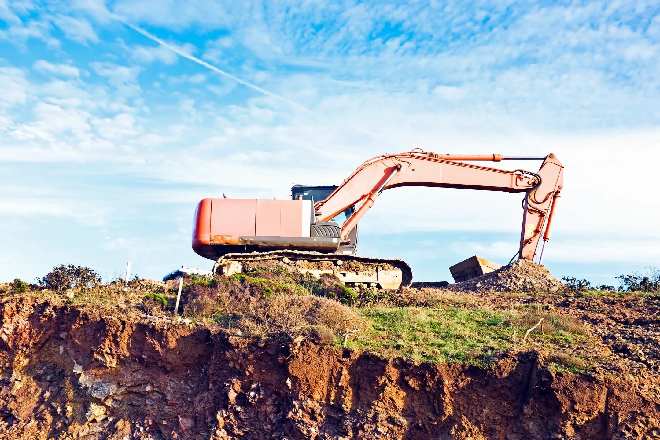 Illustrative excavation equipment performing earthwork and site preparation