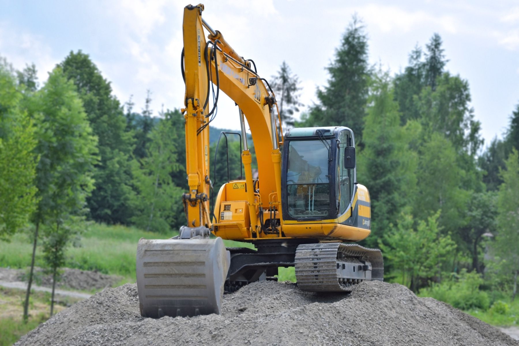 Illustrative stock photo of an excavator preparing a site